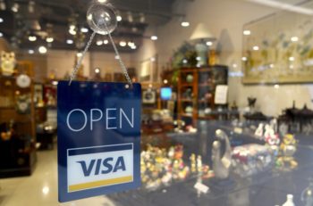 An "Open" sign on a storefront.