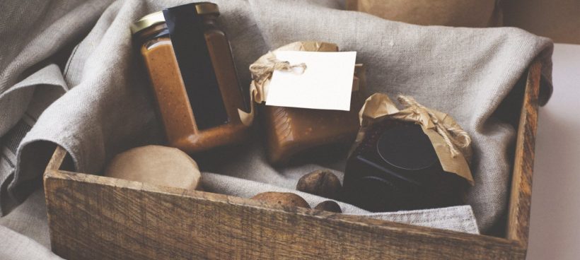 Crate with various food jars.