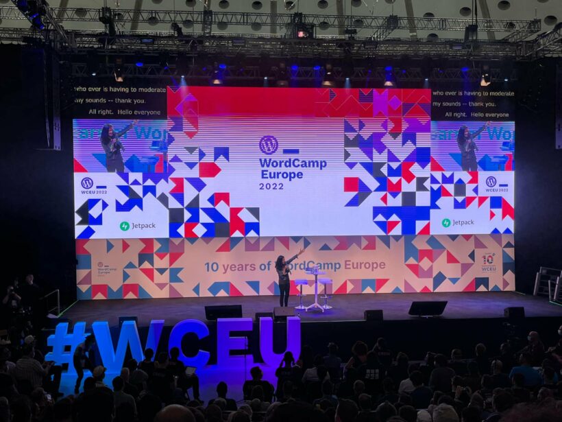 a person talking on stage at WordCamp Europe